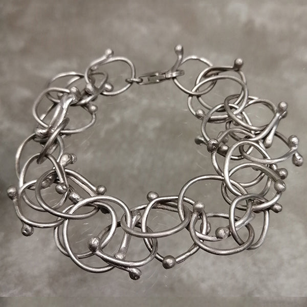 Bracciale Intrecci  artigianale in argento 925 satinato senza nichel con cerchi intrecciati fatto a mano